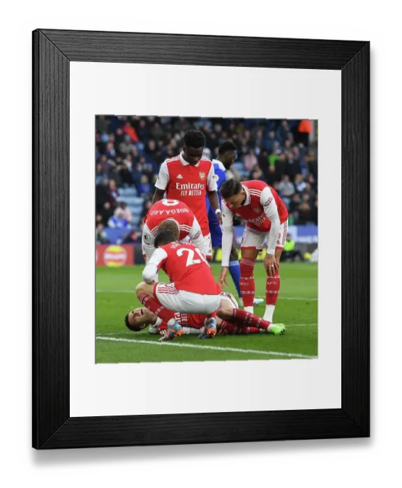 Framed Print : Arsenal's Injured Martinelli and Team Mates Amid Leicester Battle