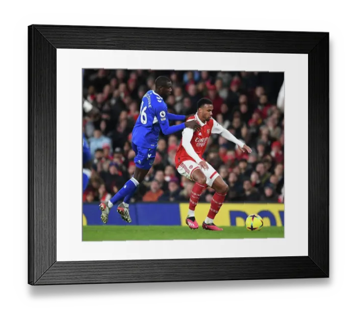 Framed Print : Arsenal's Gabriel Outmaneuvers Everton's Doucoure in Premier League Clash