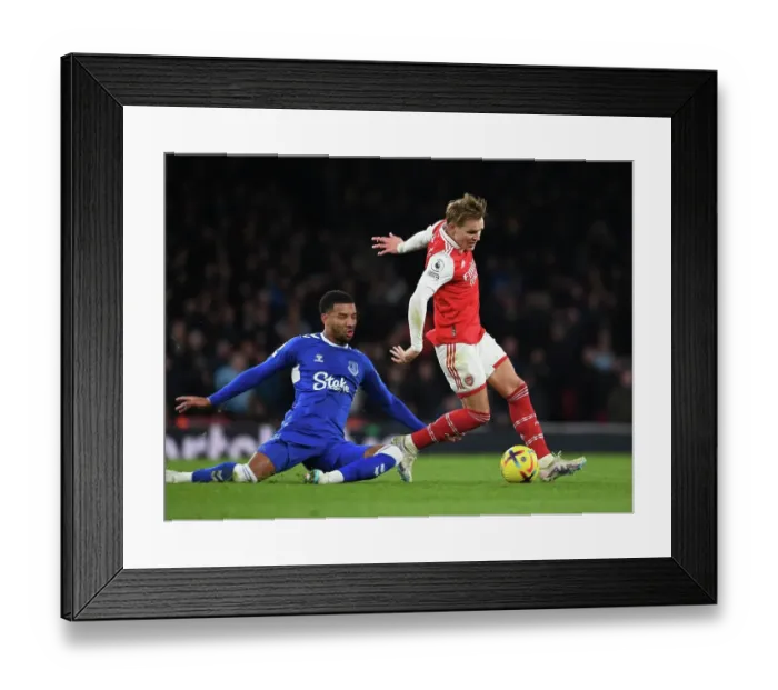 Framed Print : Arsenal's Martin Odegaard Outsmarts Everton's Ben Godfrey: A Premier League Battle at Emirates Stadium Framed Print : Arsenal's Martin Odegaard Outsmarts Everton's Ben Godfrey: A Premier League Battle at Emirates Stadium
