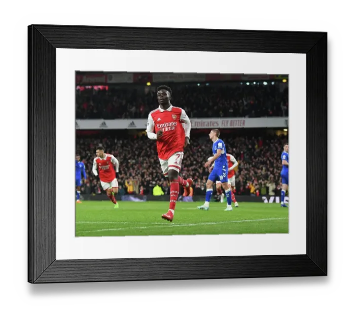 Framed Print : Saka Scores First: Arsenal Triumphs Over Everton in Premier League Clash
