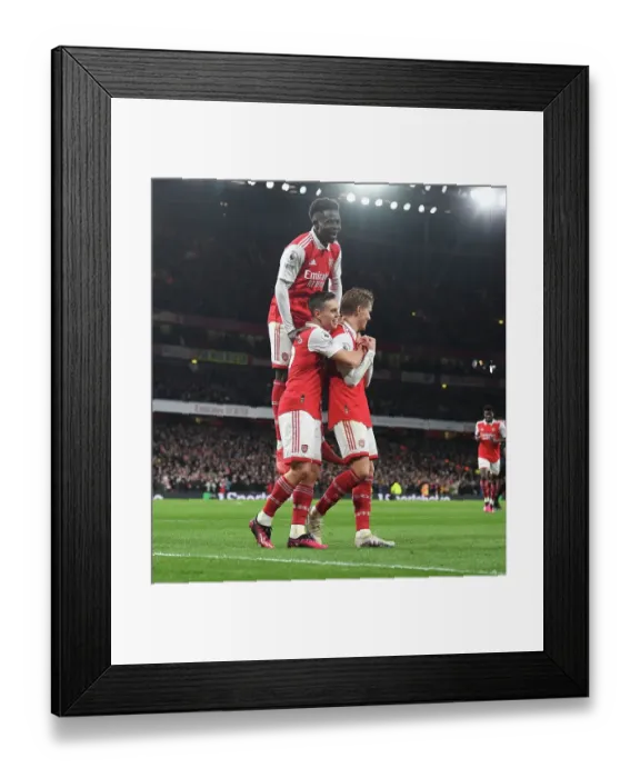 Framed Print : Arsenal's Triumph: Odegaard, Trossard, and Saka Celebrate 3rd Goal vs. Everton (2022-23) Framed Print : Arsenal's Triumph: Odegaard, Trossard, and Saka Celebrate 3rd Goal vs. Everton (2022-23)