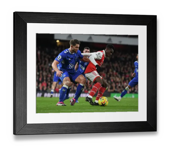 Framed Print : Arsenal's Eddie Nketiah Fends Off Everton's James Tarkowski in Intense Premier League Clash