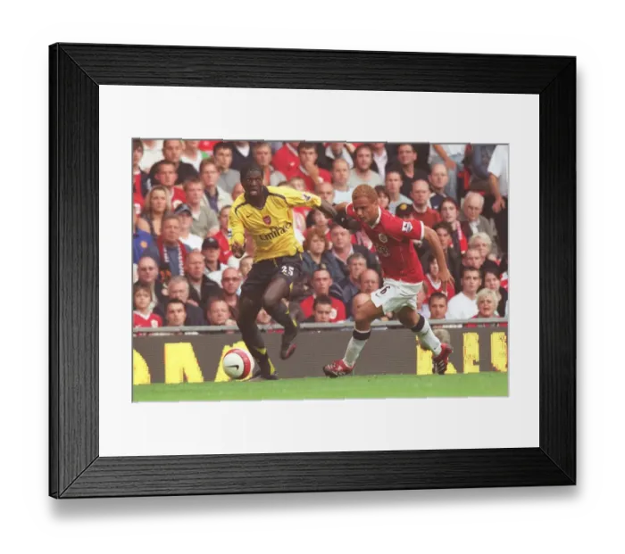 Framed Print : Emmanuel Adebayor (Arsenal) Wes Brown (Manchester United) Framed Print : Emmanuel Adebayor (Arsenal) Wes Brown (Manchester United)