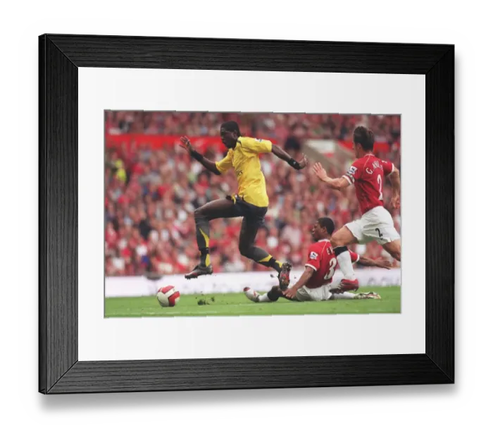 Framed Print : Adebayor's Strike: Manchester United 0-1 Arsenal (Evra vs Adebayor, 2006)