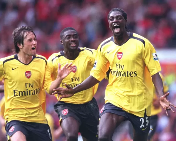 Emmanuel Adebayor celebrates scoring the Arsenal goal with Tomas Rosicky and Kolo Toure
