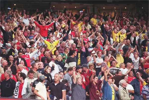 Arsenal fans celebrate after the match