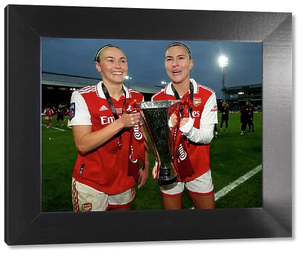 Arsenal Women Celebrate Conti Cup Victory: Steph Catley and Caitlin Foord Hold the Trophy (2023)