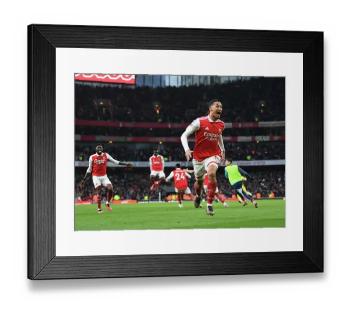 Framed Print : Arsenal's Saliba Celebrates Third Goal Against Bournemouth in Premier League Showdown (2022-23) Framed Print : Arsenal's Saliba Celebrates Third Goal Against Bournemouth in Premier League Showdown (2022-23)