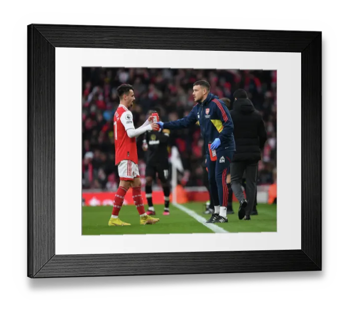 Framed Print : Arsenal: Fabio Vieira Receives Treatment from Physio Simon Murphy vs AFC Bournemouth, Premier League 2022-23