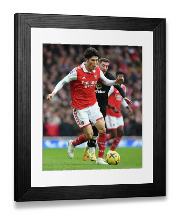 Framed Print : Arsenal's Tomiyasu in Action: Arsenal vs AFC Bournemouth, Premier League 2022-23