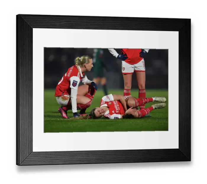 Framed Print : Arsenal Women: A Heartwarming Moment of Care and Solidarity on the Field - Arsenal vs Liverpool (2022-23)