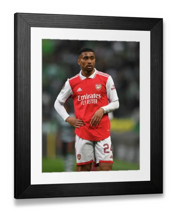 Framed Print : Arsenal's Reiss Nelson Goes Head-to-Head with Sporting CP in Europa League Showdown Framed Print : Arsenal's Reiss Nelson Goes Head-to-Head with Sporting CP in Europa League Showdown