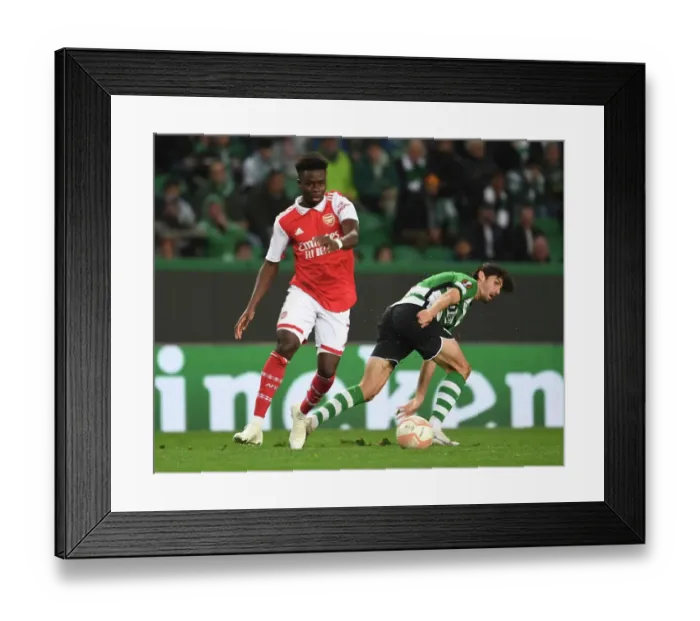 Framed Print : Bukayo Saka vs. Francisco Trincao: Arsenal's Battle in the Europa League Round of 16 against Sporting CP