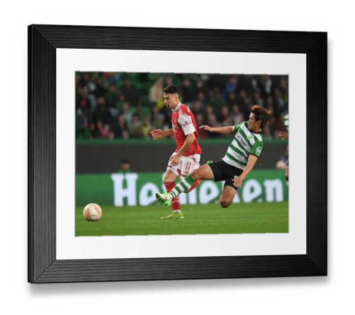 Framed Print : Gabriel Martinelli Scores Dramatic Goal Past Sporting Defender in Arsenal's Europa League Victory (March 2023)