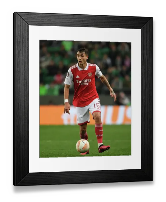 Framed Print : Arsenal's Jakub Kiwior Faces Off Against Sporting CP in Europa League Round of 16