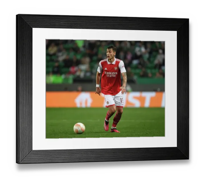 Framed Print : Arsenal's Jakub Kiwior Faces Off Against Sporting CP in Europa League Clash