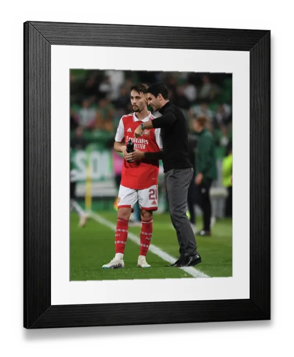 Framed Print : Mikel Arteta Engages with Fabio Vieira: Tactical Discussion between Sporting CP and Arsenal FC in Europa League Clash
