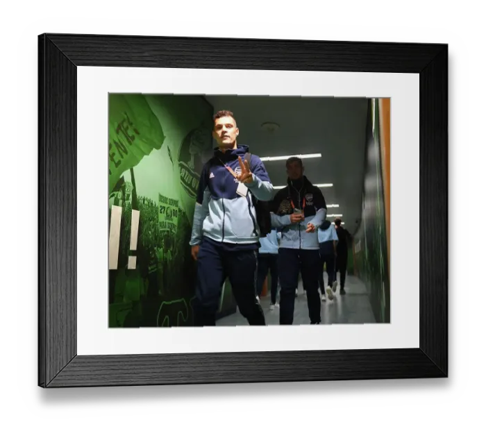 Framed Print : Granit Xhaka's Focus: Arsenal's Battle in Lisbon - UEFA Europa League Round of 16, Sporting CP vs Arsenal FC