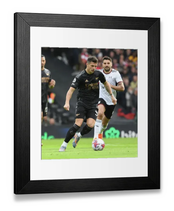 Framed Print : Granit Xhaka: Arsenal's Midfield Maestro in Action against Fulham, Premier League 2022-23 Framed Print : Granit Xhaka: Arsenal's Midfield Maestro in Action against Fulham, Premier League 2022-23