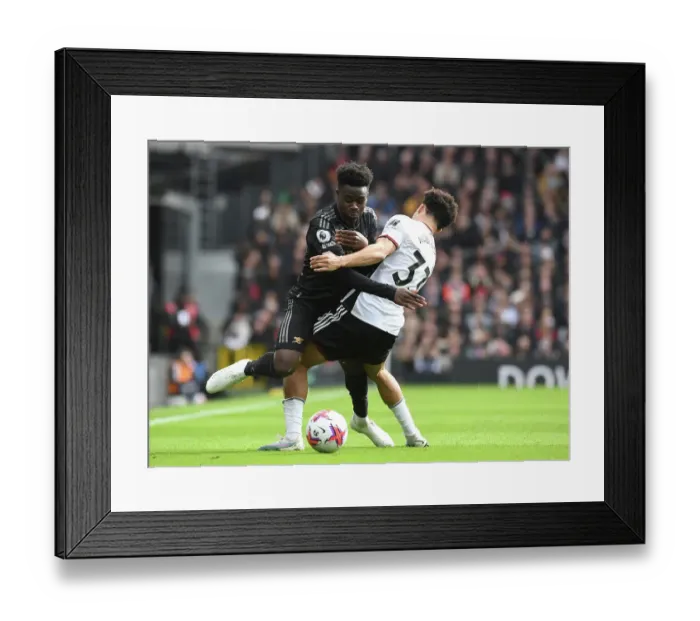 Framed Print : Fulham vs. Arsenal: Bukayo Saka Fouled by Robinson in Premier League Clash (2022-23)