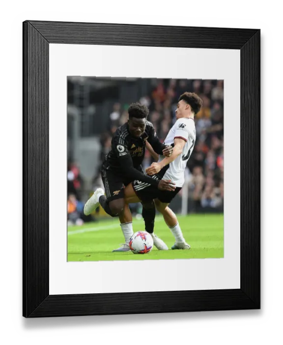 Framed Print : Bukayo Saka Fouled by Antonee Robinson in Fulham vs Arsenal Premier League Clash (2022-23)