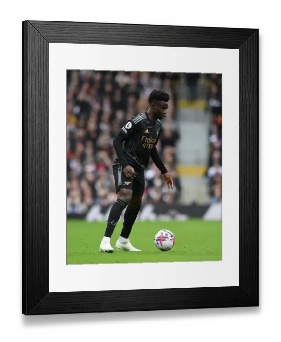 Framed Print : Arsenal's Bukayo Saka Shines in Premier League Clash Against Fulham (2022-23)