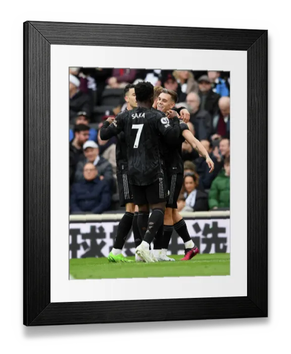 Framed Print : Arsenal's Triumph: Odegaard and Trossard Celebrate Third Goal vs Fulham (2022-23)