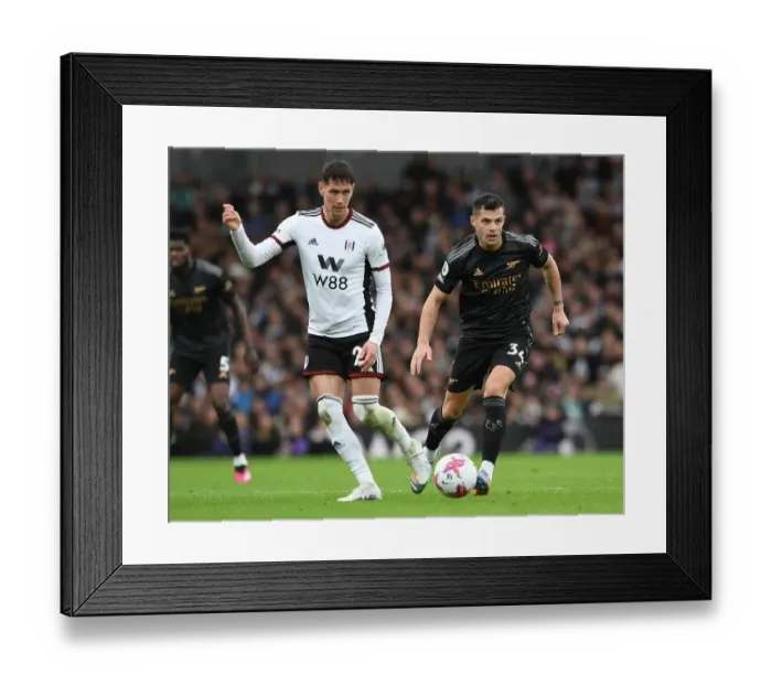 Framed Print : Granit Xhaka Closes Down Sasa Lukic: Intense Moment from Fulham vs. Arsenal Premier League Clash (2022-23)