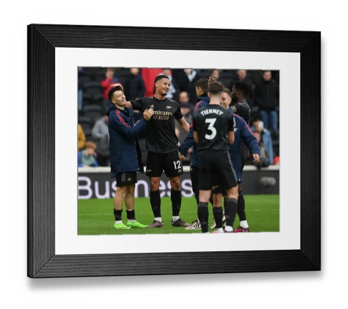 Framed Print : Arsenal's William Saliba and Gabriel Martinelli Celebrate Victory over Fulham in Premier League