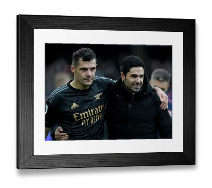 Framed Print : Arsenal's Mikel Arteta and Granit Xhaka Celebrate Victory over Fulham in Premier League 2022-23 Framed Print : Arsenal's Mikel Arteta and Granit Xhaka Celebrate Victory over Fulham in Premier League 2022-23