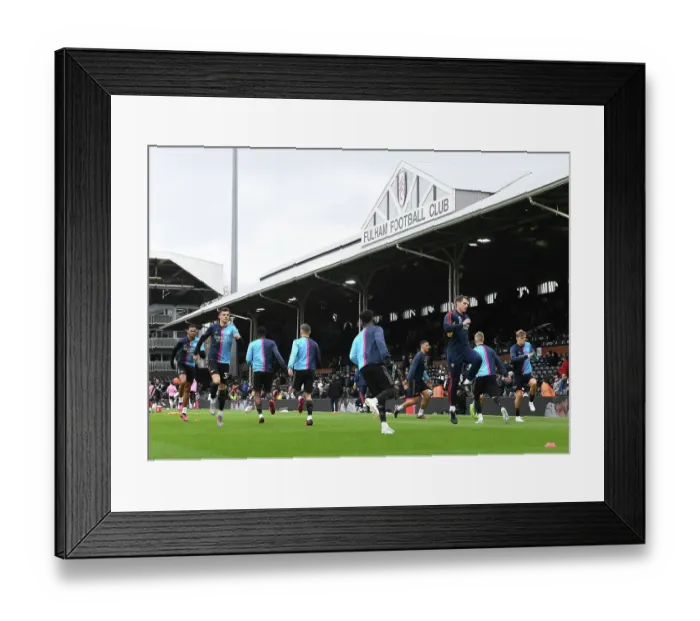 Framed Print : Arsenal Sports Scientist Tom Allen Leads Pre-Match Warm-Up at Fulham vs Arsenal (Fulham v Arsenal 2022-23)