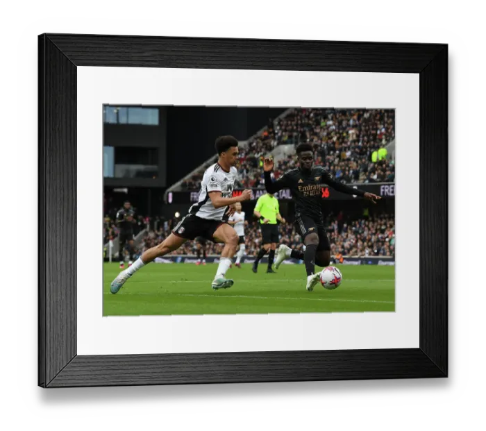 Framed Print : Bukayo Saka vs Antonee Robinson: Intense Battle at Craven Cottage - Fulham vs Arsenal, Premier League 2022-23 Framed Print : Bukayo Saka vs Antonee Robinson: Intense Battle at Craven Cottage - Fulham vs Arsenal, Premier League 2022-23