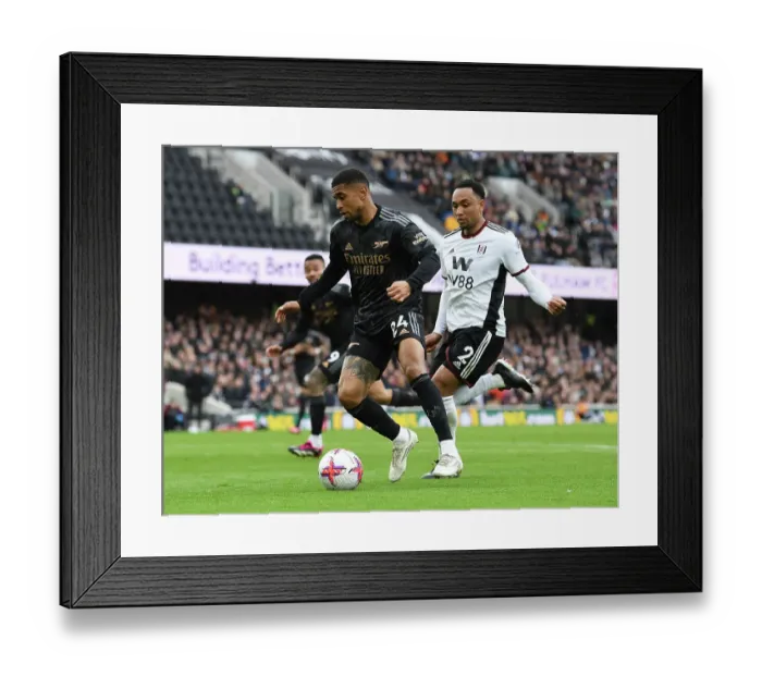 Framed Print : Reiss Nelson vs. Kenny Tete: Battle at Craven Cottage - Fulham vs. Arsenal, Premier League 2022-23