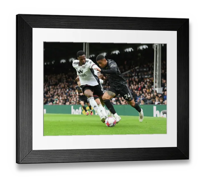 Framed Print : Reiss Nelson vs Tosin Adarabioyo: Battle at Craven Cottage - Fulham vs Arsenal, Premier League 2022-23