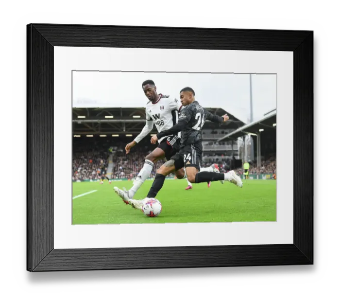 Framed Print : Arsenal's Nelson Clashes with Fulham's Adarabioyo: A Premier League Battle at Craven Cottage Framed Print : Arsenal's Nelson Clashes with Fulham's Adarabioyo: A Premier League Battle at Craven Cottage