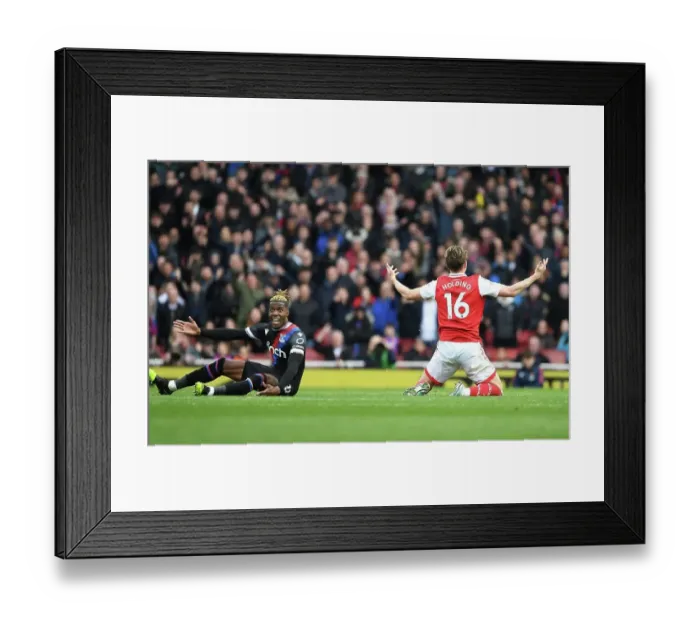 Framed Print : Arsenal vs Crystal Palace: Rob Holding and Wilfred Zaha Clash in Premier League Showdown at Emirates Stadium Framed Print : Arsenal vs Crystal Palace: Rob Holding and Wilfred Zaha Clash in Premier League Showdown at Emirates Stadium