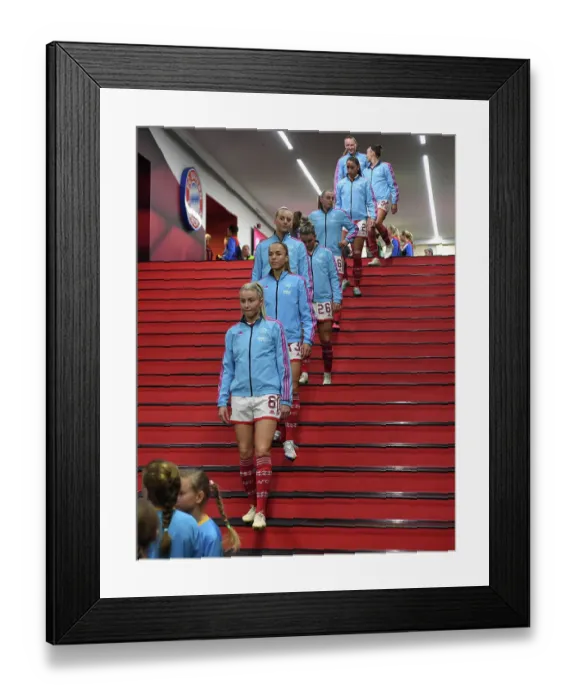 Framed Print : Leah Williamson's Determined Climb: Arsenal's Quarter-Final Battle at Allianz Arena against FC Bayern Munich, UEFA Women's Champions League 2022-23