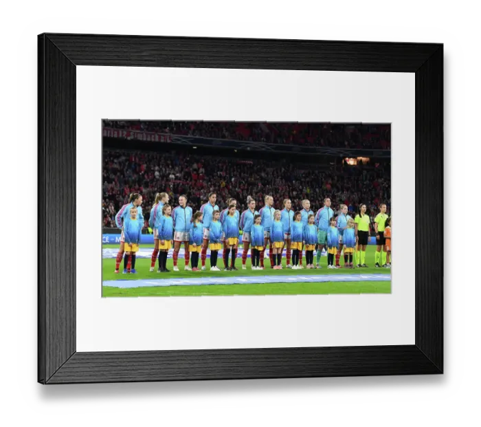 Framed Print : Arsenal vs. Bayern Munich: A Battle in the UEFA Women's Champions League Quarter-Finals at Allianz Arena