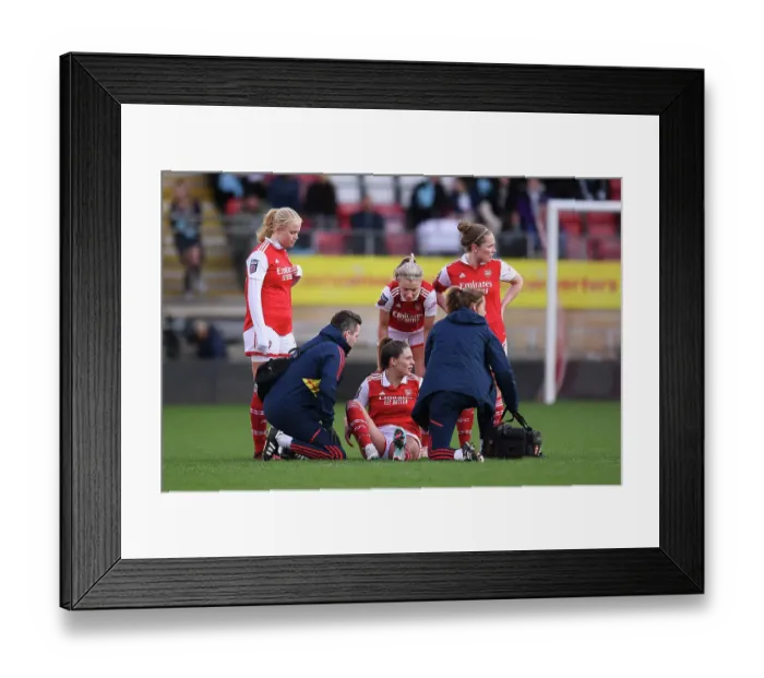 Framed Print : Arsenal Women Show Support: Kuhl, Williamson, and Little Console Injured Teammate Queiroz During Tottenham Clash