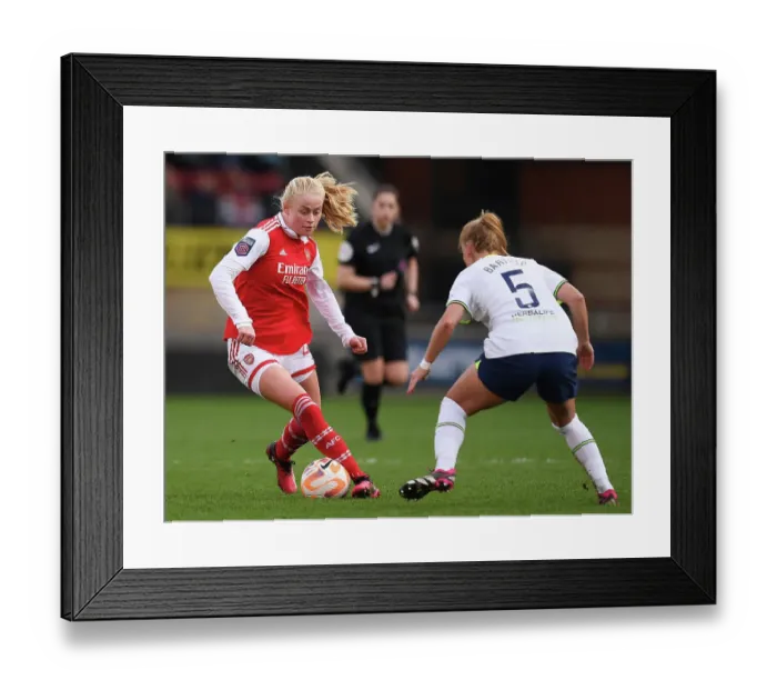Framed Print : Arsenal's Kathrine Kuhl Overpowers Tottenham's Molly Bartrip in FA Women's Super League Showdown