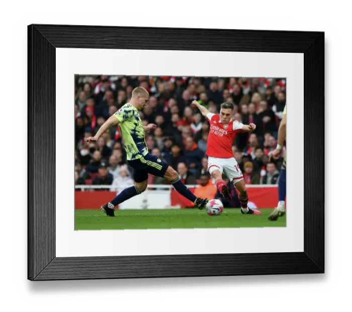 Framed Print : Arsenal vs Leeds United: Trossard vs Kristensen - Premier League Clash at Emirates Stadium