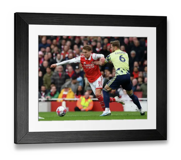 Framed Print : Arsenal vs Leeds United: Martin Odegaard vs Liam Cooper Clash in the Premier League