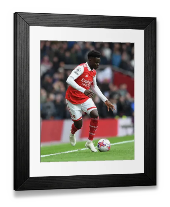 Framed Print : Arsenal's Bukayo Saka in Action against Leeds United, Premier League 2022-23 Framed Print : Arsenal's Bukayo Saka in Action against Leeds United, Premier League 2022-23
