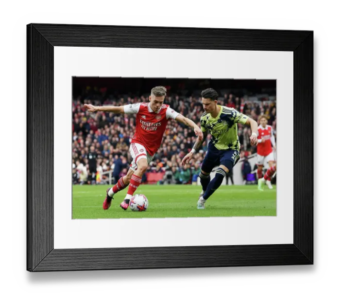 Framed Print : Arsenal's Trossard Faces Off Against Leeds Koch in Intense Premier League Clash