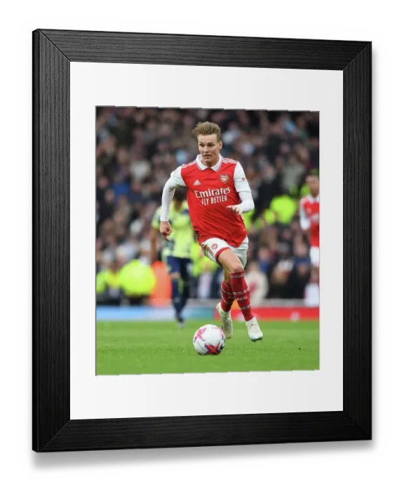 Framed Print : Arsenal's Martin Odegaard Faces Off Against Leeds United in the Premier League Framed Print : Arsenal's Martin Odegaard Faces Off Against Leeds United in the Premier League