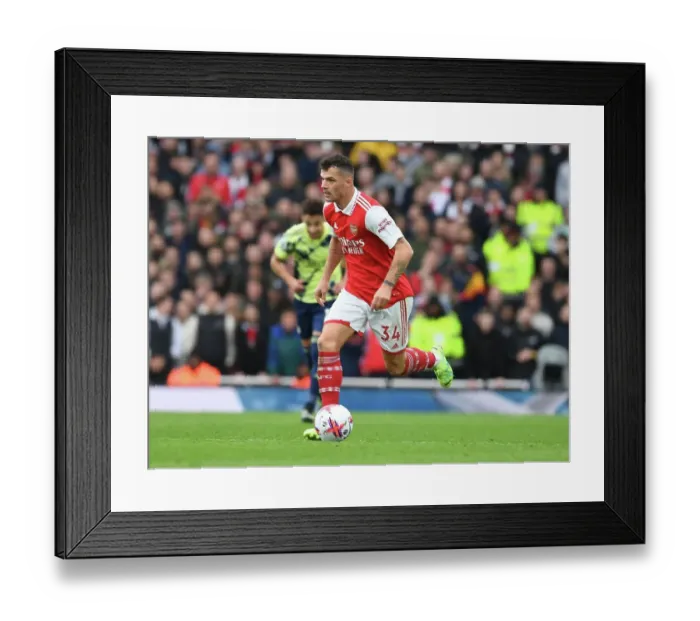 Framed Print : Granit Xhaka: Arsenal's Midfield Maestro in Action against Leeds United, Premier League 2022-23
