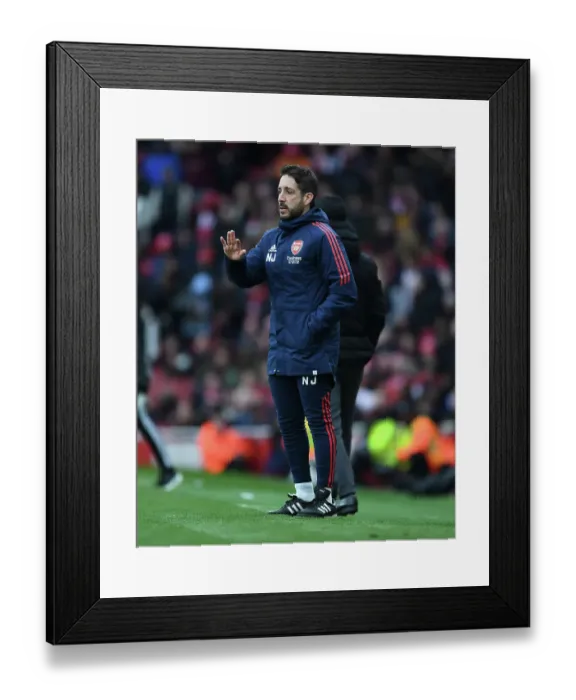Framed Print : Arsenal Coach Nico Jover at the April 2023 Arsenal vs. Leeds United Premier League Match