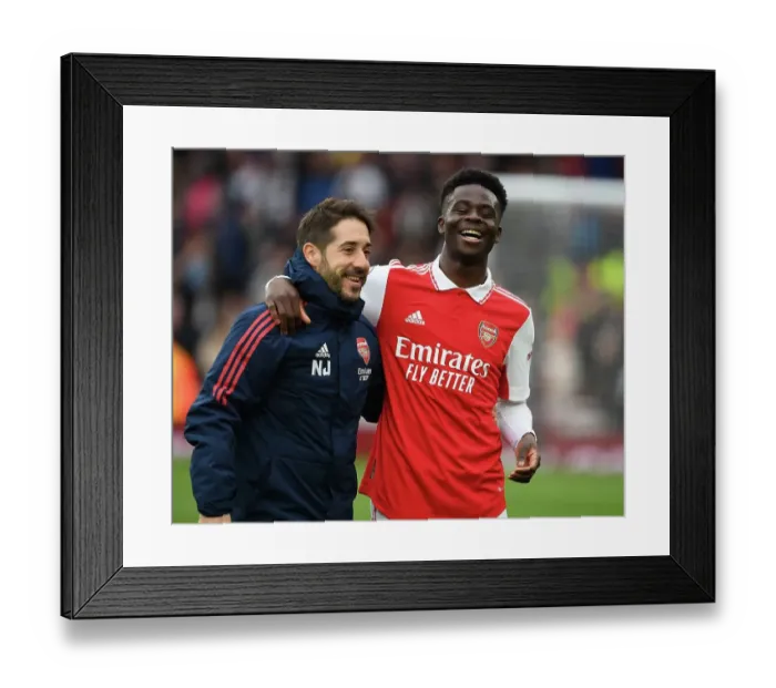 Framed Print : Arsenal's Triumph: Nico Jover and Bukayo Saka Celebrate in the Premier League 2022-23