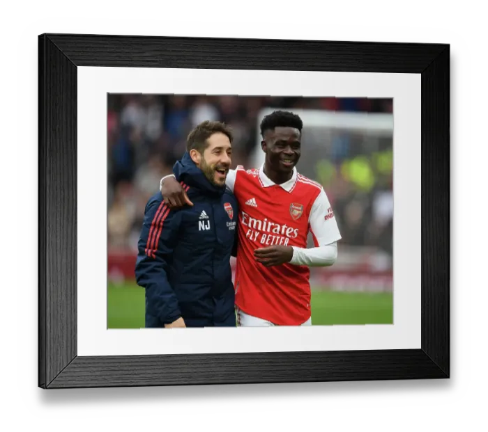 Framed Print : Arsenal's Nico Jover Congratulates Bukayo Saka after Arsenal v Leeds United, Premier League 2022-23