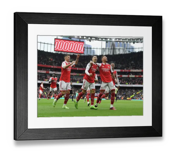 Framed Print : Triumphant Threesome: White, Xhaka, Martinelli Celebrate Arsenal's Goal Against Leeds United